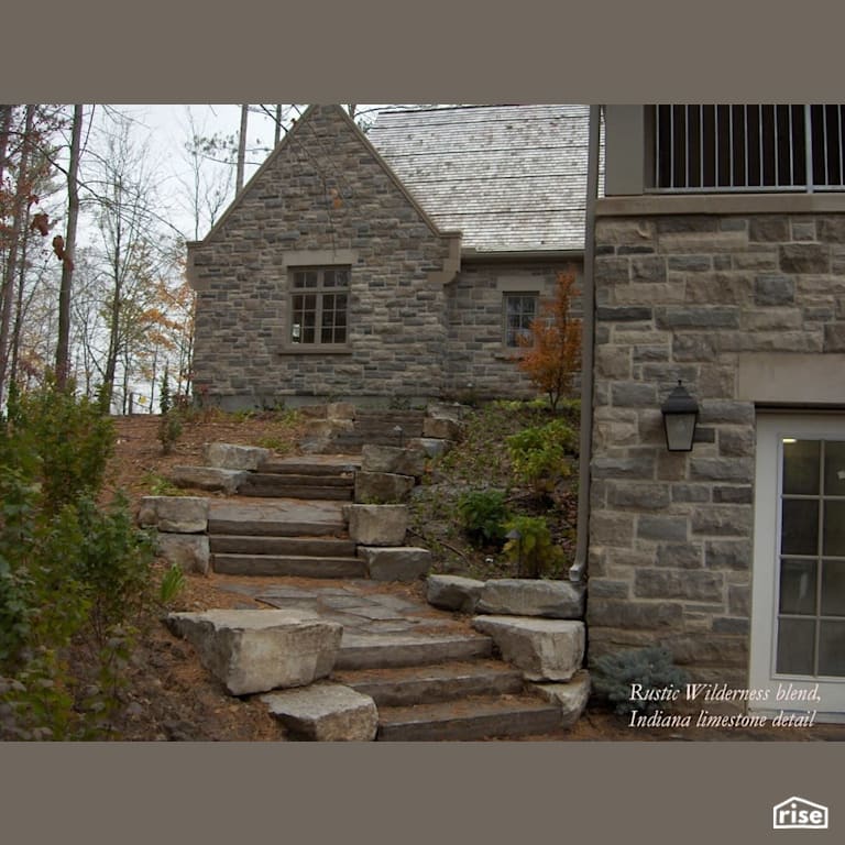 Stone home with custom stone walkway with Stone Siding by Masonal Stone Inc