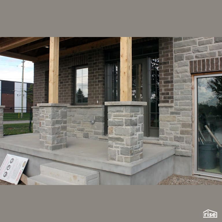 Home with stone siding entryway with Stone Siding by Masonal Stone Inc