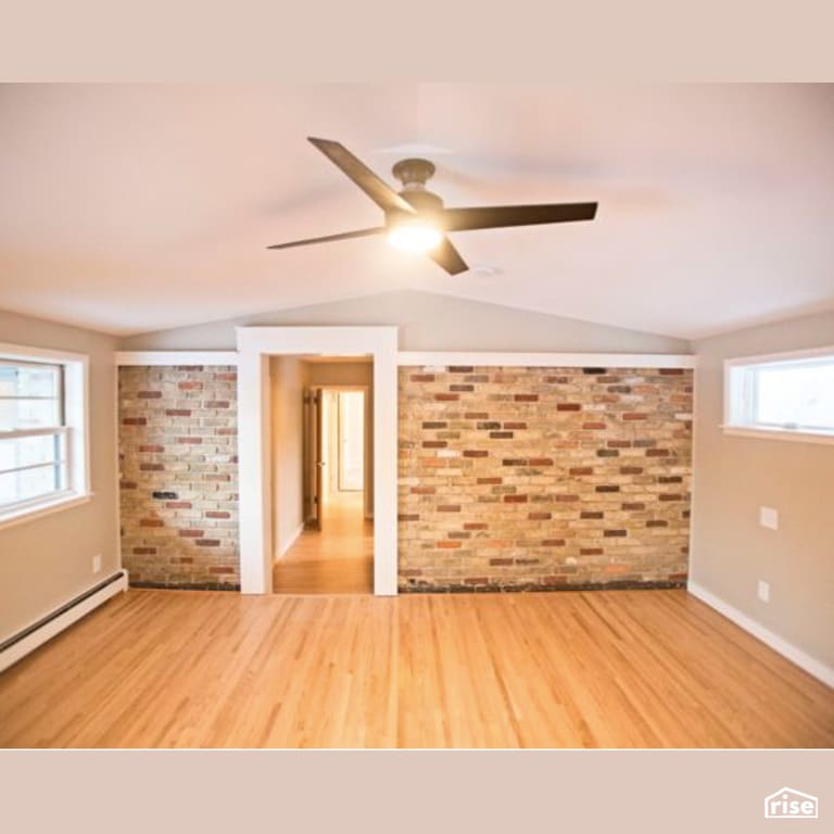 Living Room with FSC Certified Hardwood by Constructive Builders