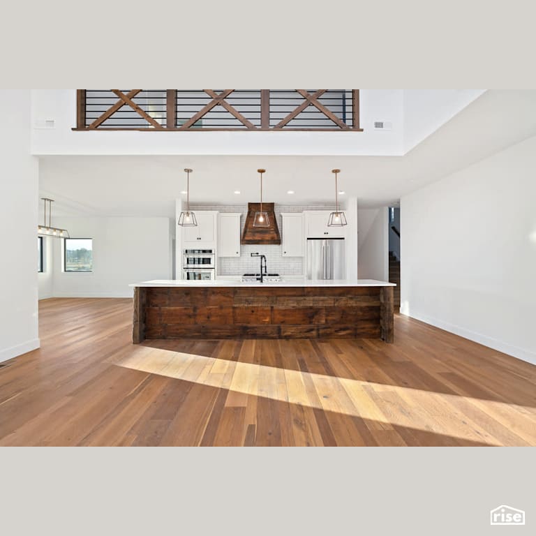 Open concept kitchen with reclaimed wood with Integrated LED by Revolve Design Build