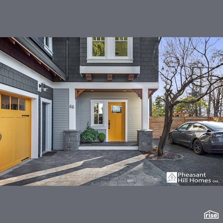 Front Door with Accent Outdoor Lighting by Pheasant Hill Homes Ltd.