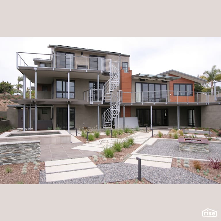 Rear Exterior with Accent Outdoor Lighting by Alliance Green Builders