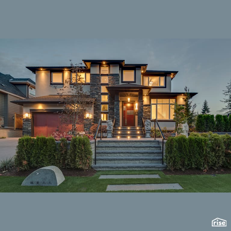 Executive Elegance - Exterior with Accent Outdoor Lighting by Clay Construction