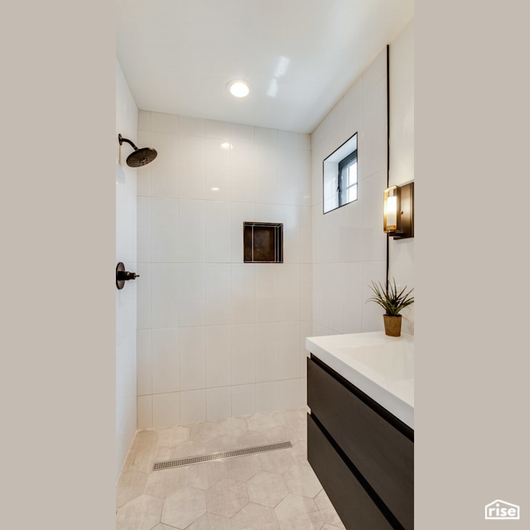 Low-flow shower to the right of vanity with Integrated LED by Revolve Design Build
