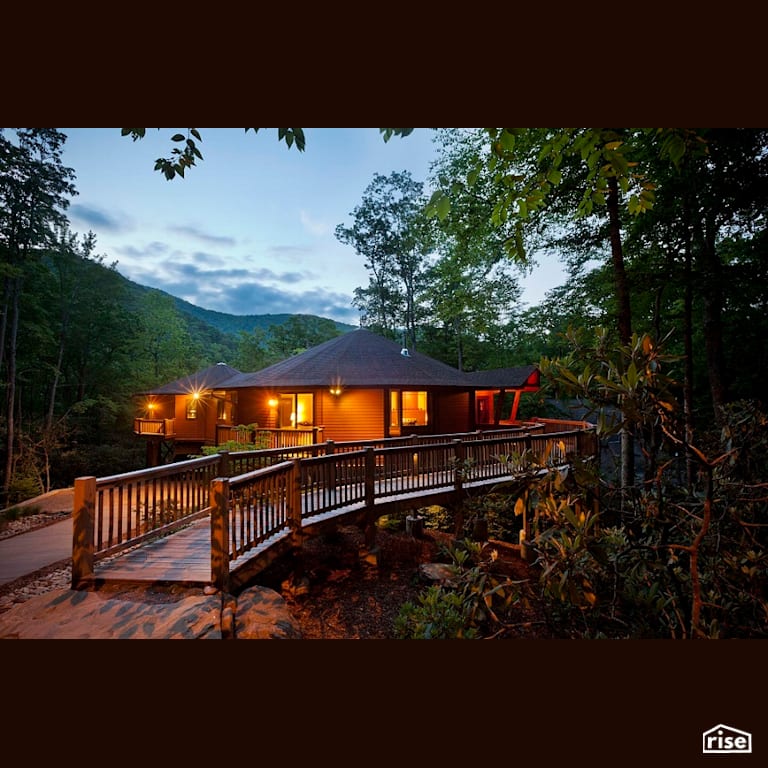 Front exterior with long walkway with Accent Outdoor Lighting by Deltec Homes