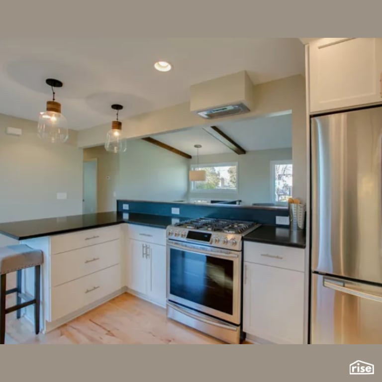 Kitchen with Gas Range by Constructive Builders