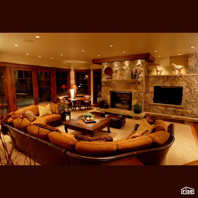 Family room with stone fireplace and large doors with Energy Star Exterior Door by Alpen High Performance Products