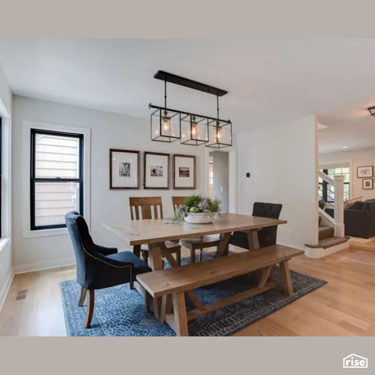 Dining Room with Laminate Flooring by Constructive Builders