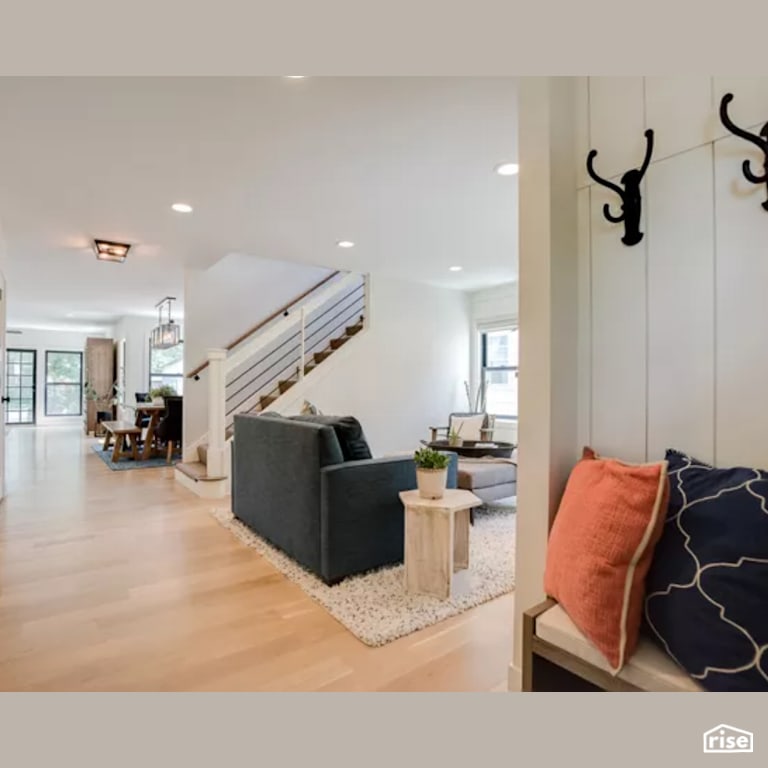 Living Room and Staircase with Energy Star Exterior Door by Constructive Builders