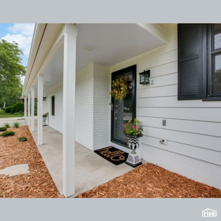 Exterior Entryway with Wood Mulch by Constructive Builders