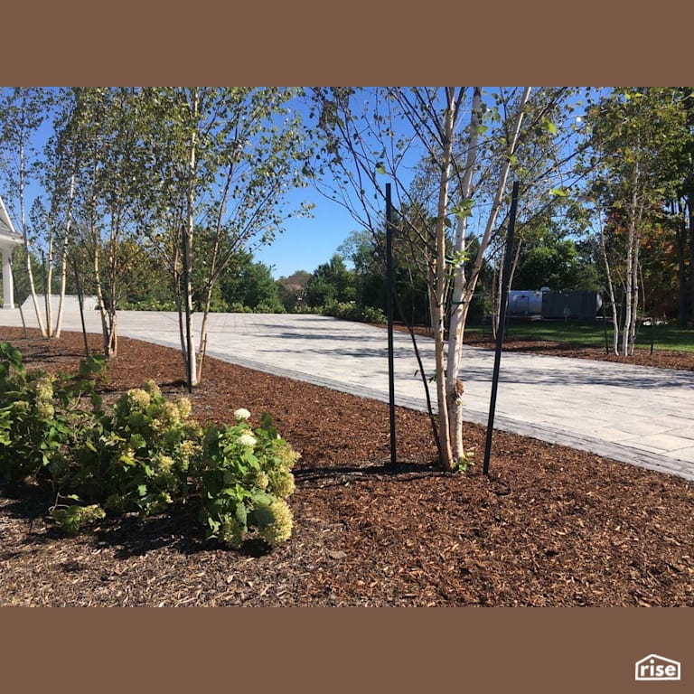 Driveway Landscaping with Paver Stones with Wood Mulch by Earthworks Landscape & Design