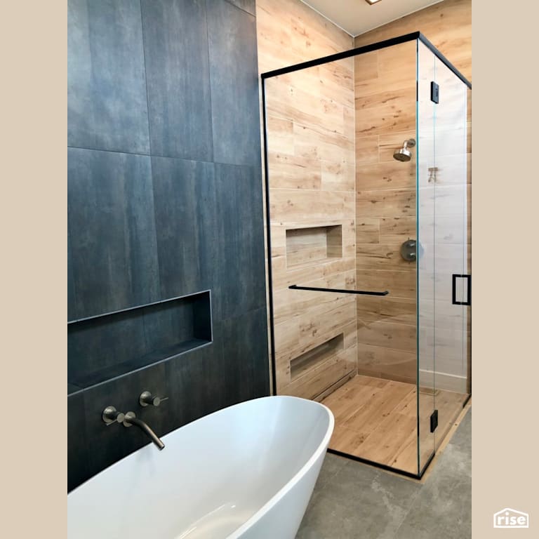 Soaker tub and low-flow shower with Low-Flow Showerhead by Revolve Design Build