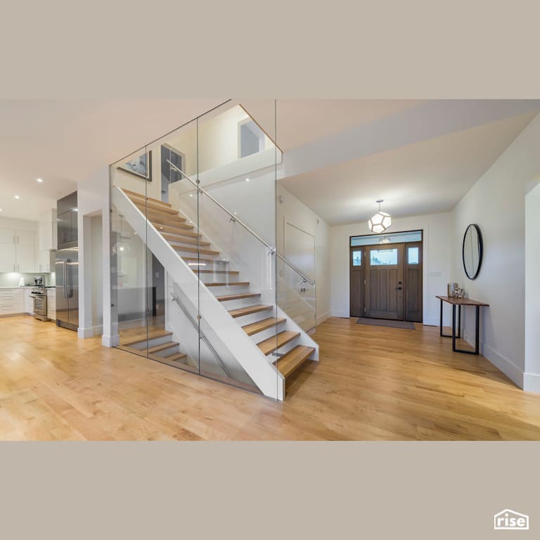 Timeless Escape - Entryway and Staircase with Solid Wood Door by Homes by Highgate