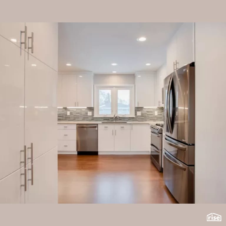 Kitchen with Wood Veneer Cabinet by Constructive Builders