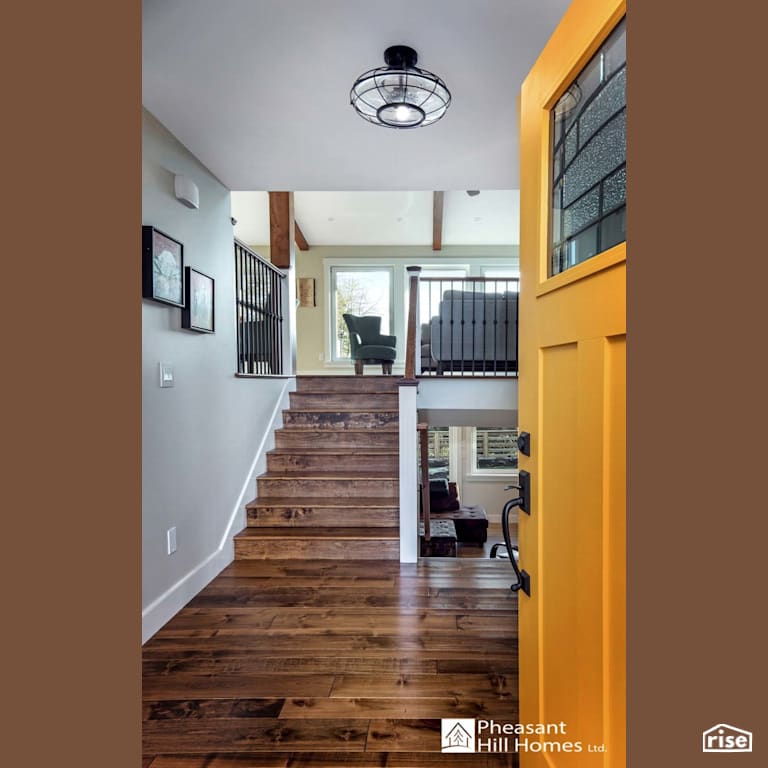 Entryway with Engineered Hardwood by Pheasant Hill Homes Ltd.