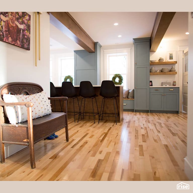 Hall leading to kitchen and island with Engineered Hardwood by J Russon Construction
