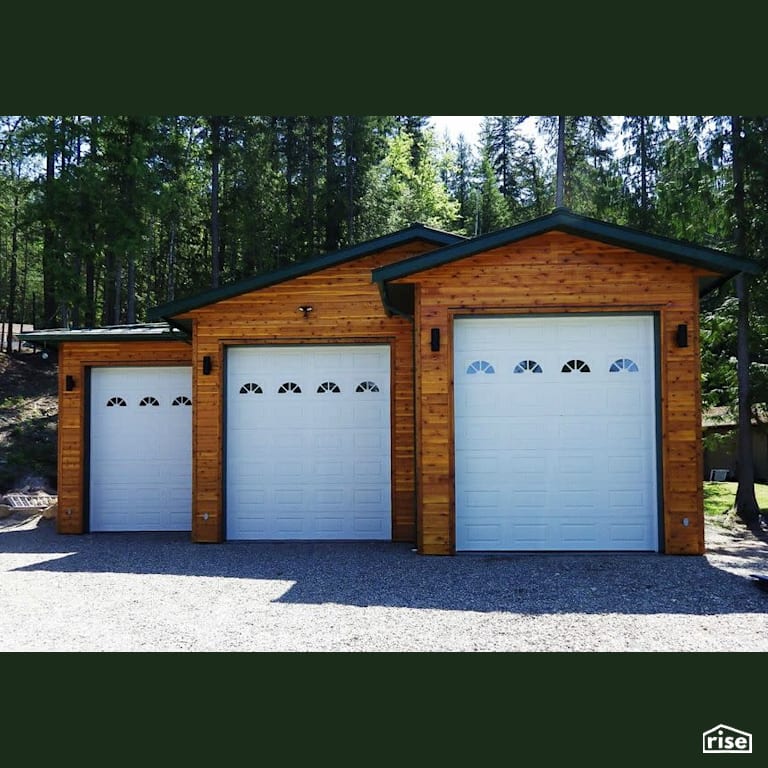 Copper Island Fine Homes - Exteriors with Wall Mounted Outdoor Lighting by Copper Island Fine Homes Inc.
