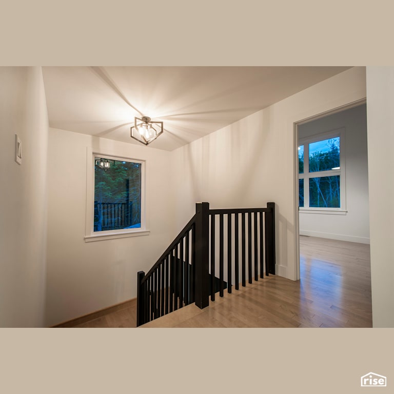 Modern Retreat - Staircase with Ceiling Light by Homes by Highgate