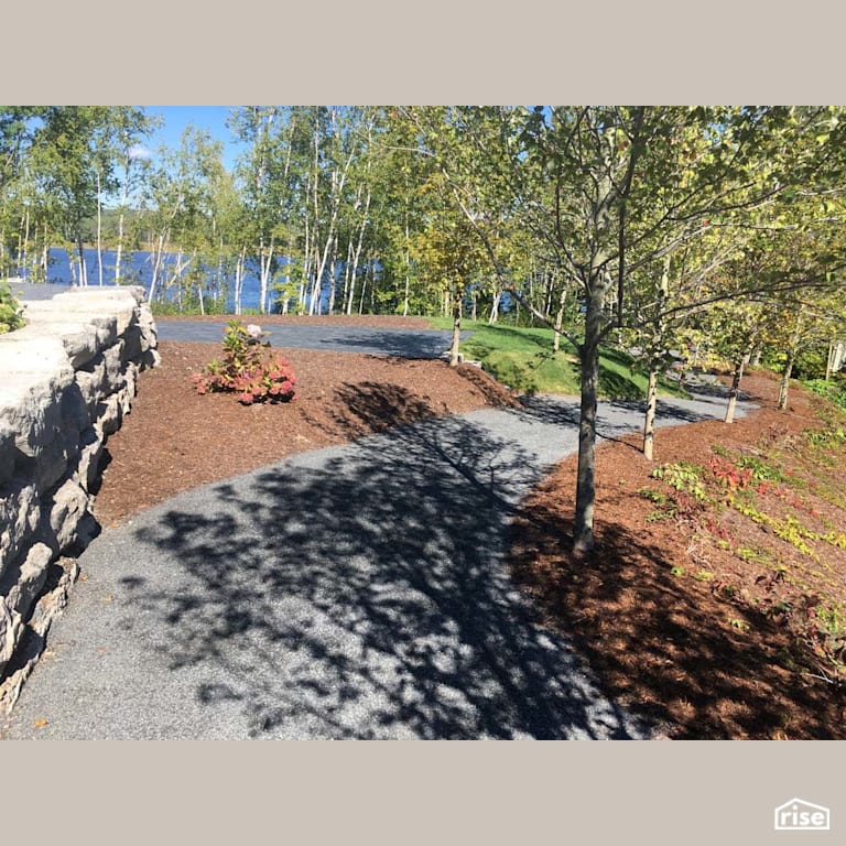 Backyard Walkway with Wood Mulch by Earthworks Landscape & Design