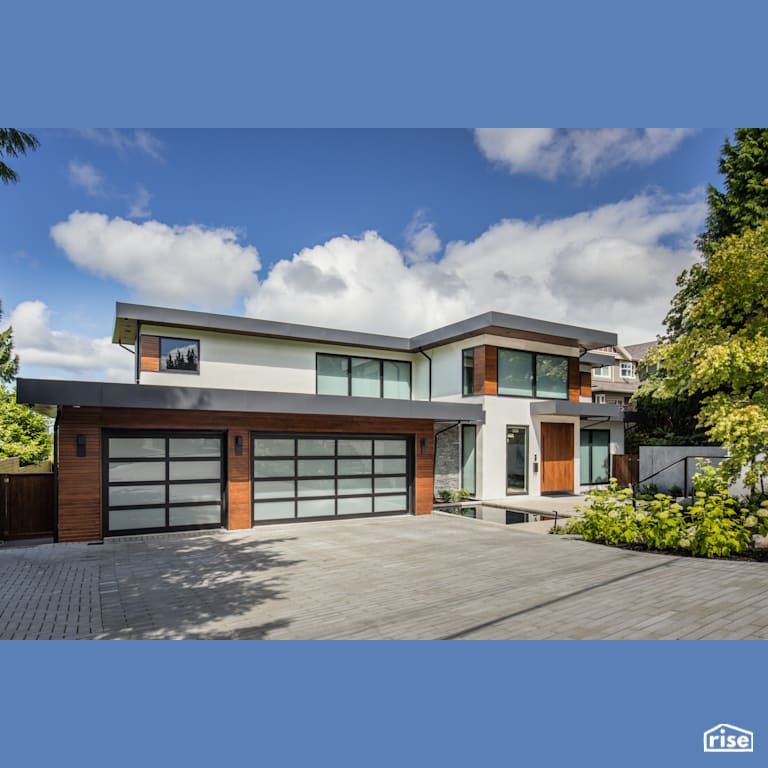 The Driveway and Garages for Three Cars with Triple Pane Window by Synthesis Design
