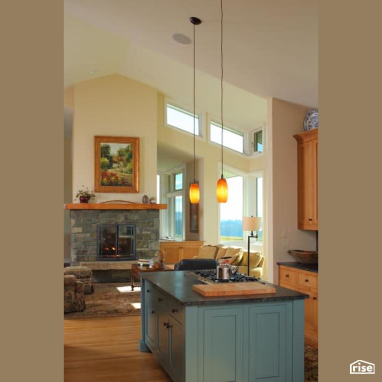 Kitchen Island and Living Room with Gas Fireplace by Winsome Construction
