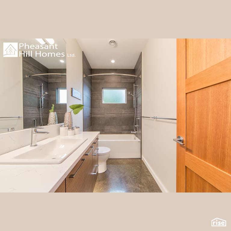 Beachfront Living - Bathroom with Low-Flow Showerhead by Pheasant Hill Homes Ltd.
