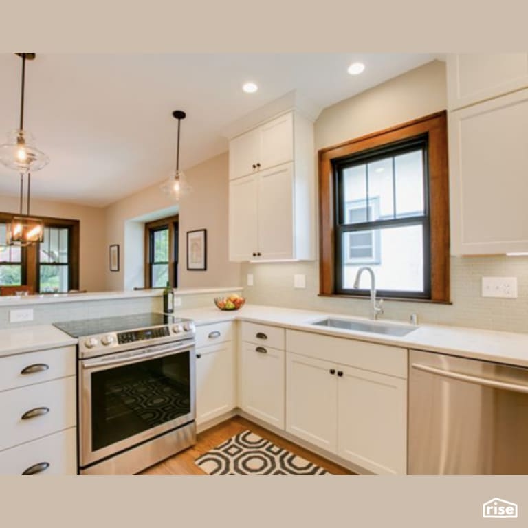 Kitchen with Low-Flow Kitchen Faucet by Constructive Builders