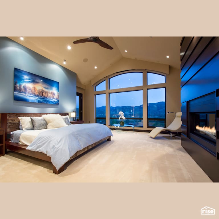 Master suite with large windows and feature fireplace with Fixed Window by Alpen High Performance Products