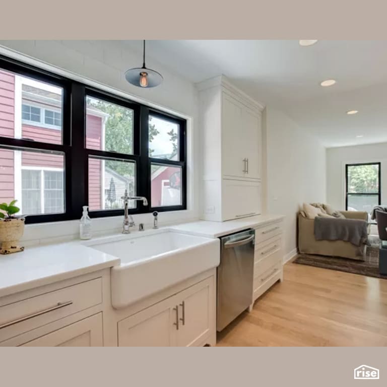 Kitchen with Low-Flow Kitchen Faucet by Constructive Builders