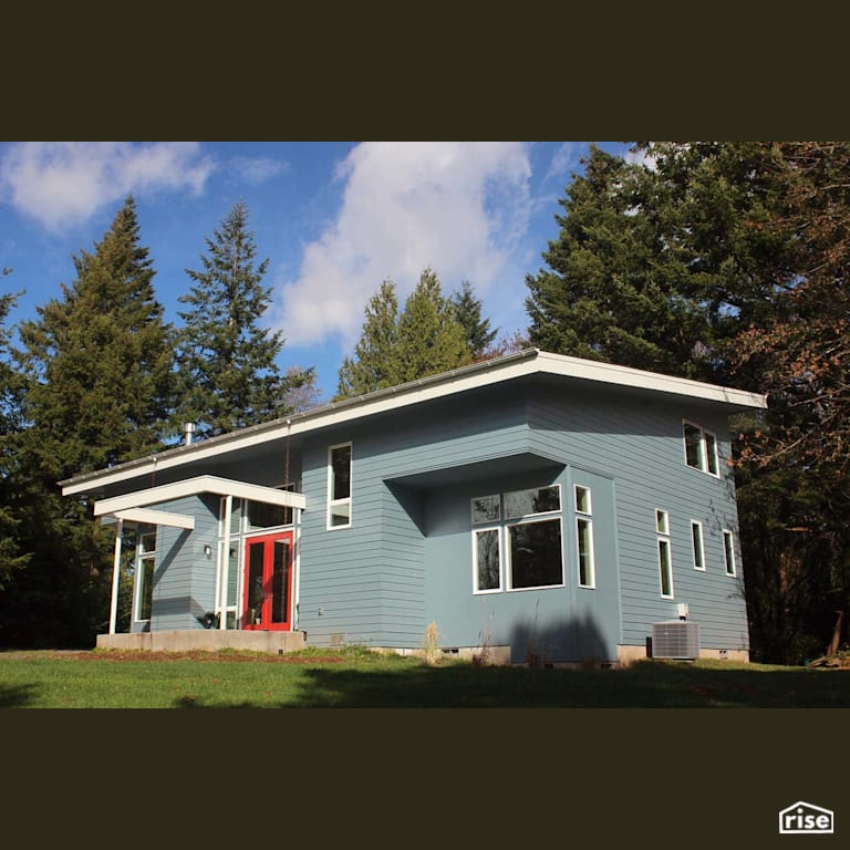 Home Exterior with Fixed Window by Winsome Construction