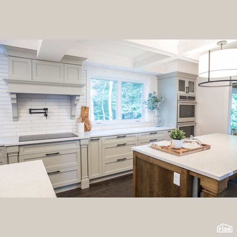 Bright kitchen with white countertop with Induction Cooktop by Reimagine Designs