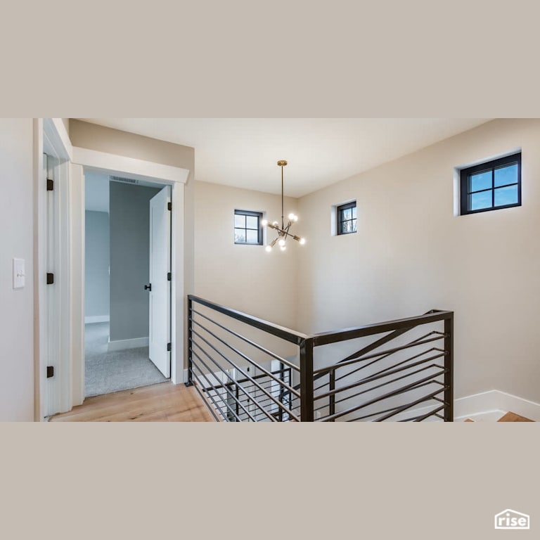 Staircase with feature lighting with Fixed Window by Revolve Design Build