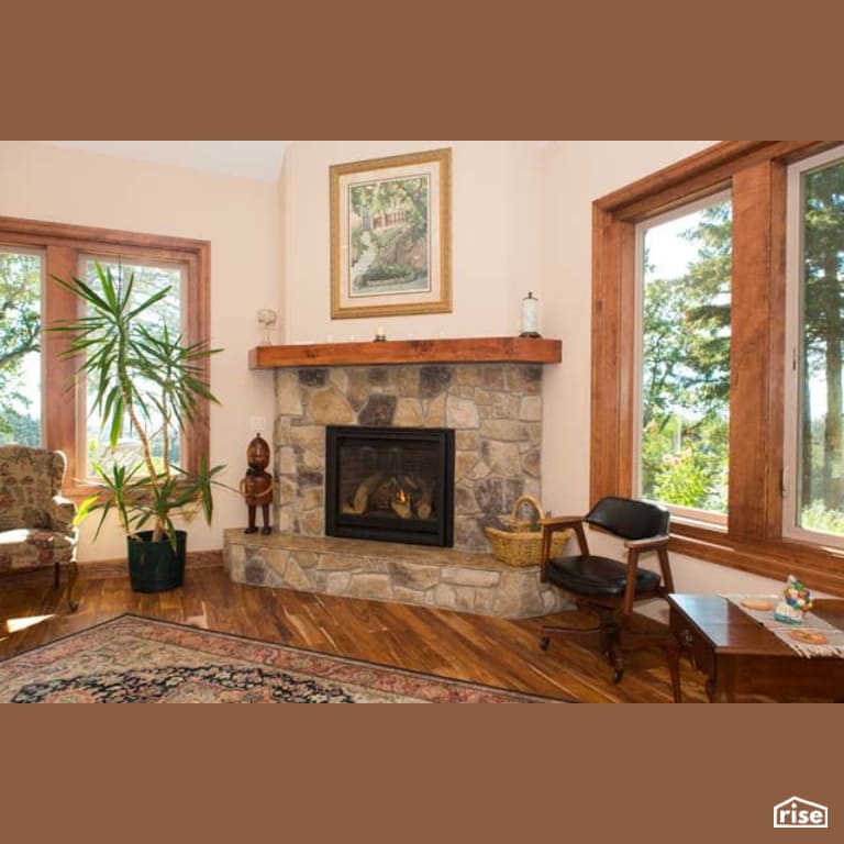 Living Room with Gas Range by Winsome Construction