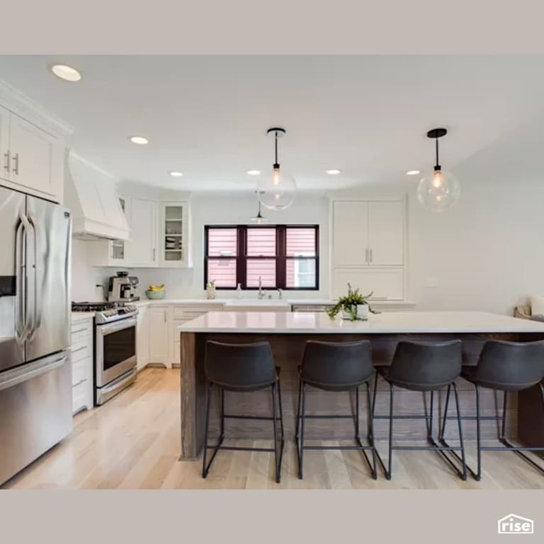 Kitchen with Low-Flow Kitchen Faucet by Constructive Builders