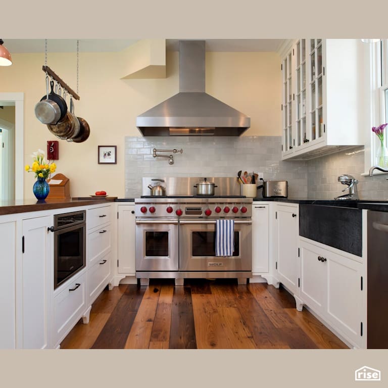 Jamaica Plans White Kitchen with Gas Range by Helios Design Group