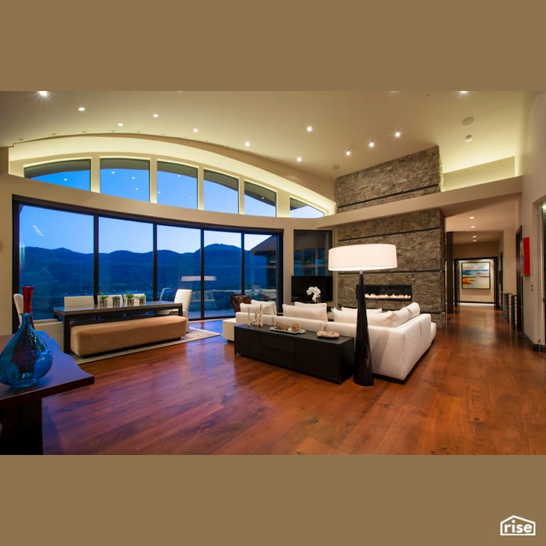 Great room with large bay windows and feature fireplace with Fixed Window by Alpen High Performance Products