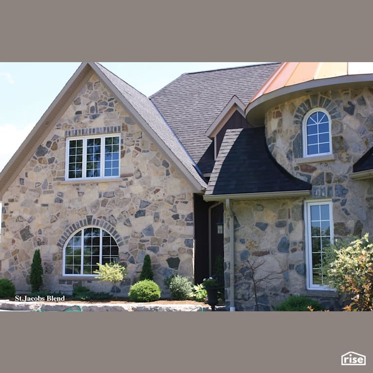 Stone house with feature metal roof with Standing Seam Metal Roof by Masonal Stone Inc
