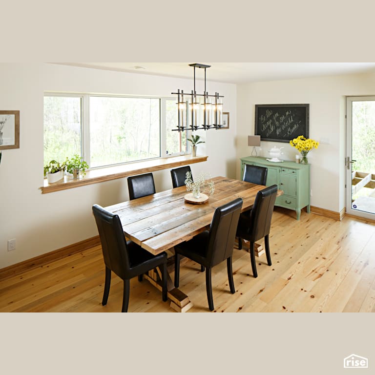 Red Castle Dining Room with Reclaimed Hardwood by The Conscious Builder