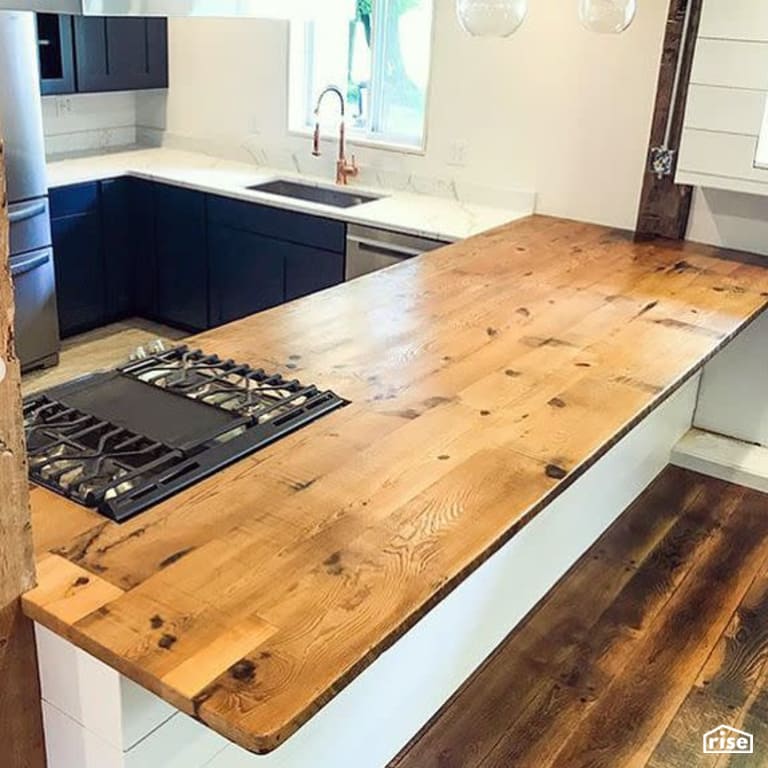 Open concept kitchen with finished wood countertop with Interior Wood Finish by Vermont Natural Coatings