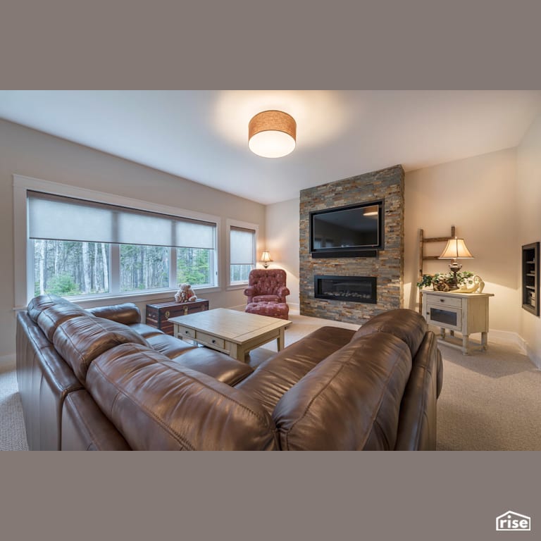A River Runs Through - Living Room with Gas Fireplace by Homes by Highgate
