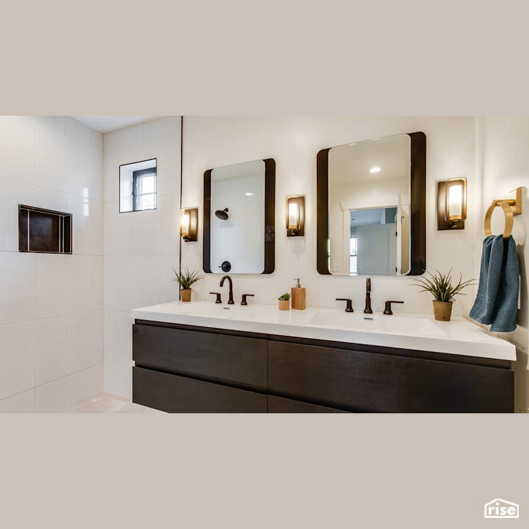 Chocolate colored double vanity with Wall Mounted Outdoor Lighting by Revolve Design Build