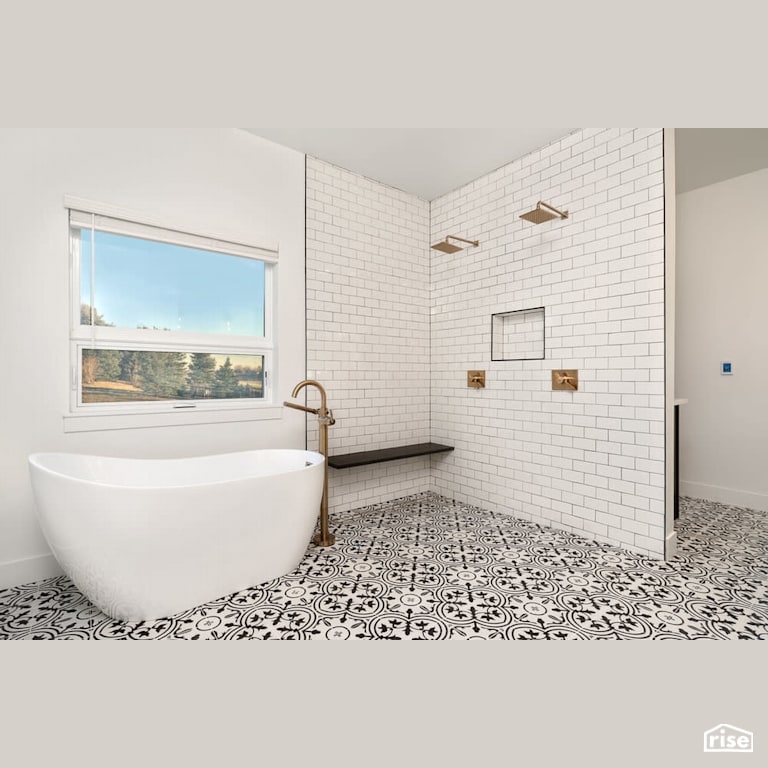 Dual low flow shower with soaker tub with Low-Flow Showerhead by Revolve Design Build
