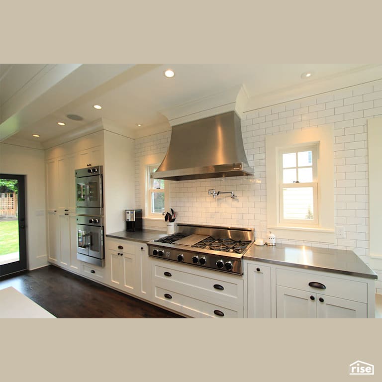 Craftsman kitchen with subway tile and stainless steel range hood with Wall Oven by Gant Nychay Architecture PLLC