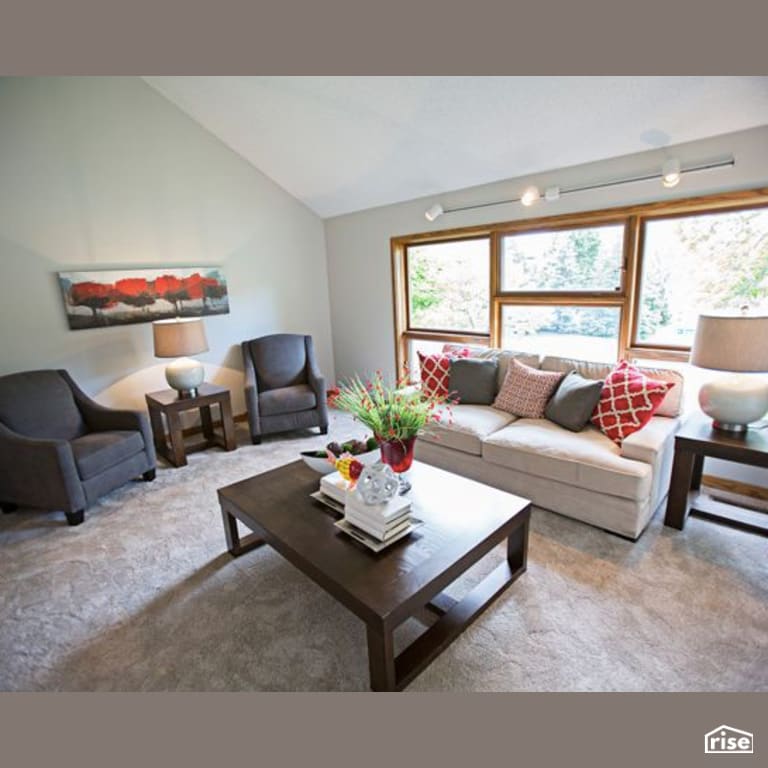 Family Room with Wall Light by Constructive Builders