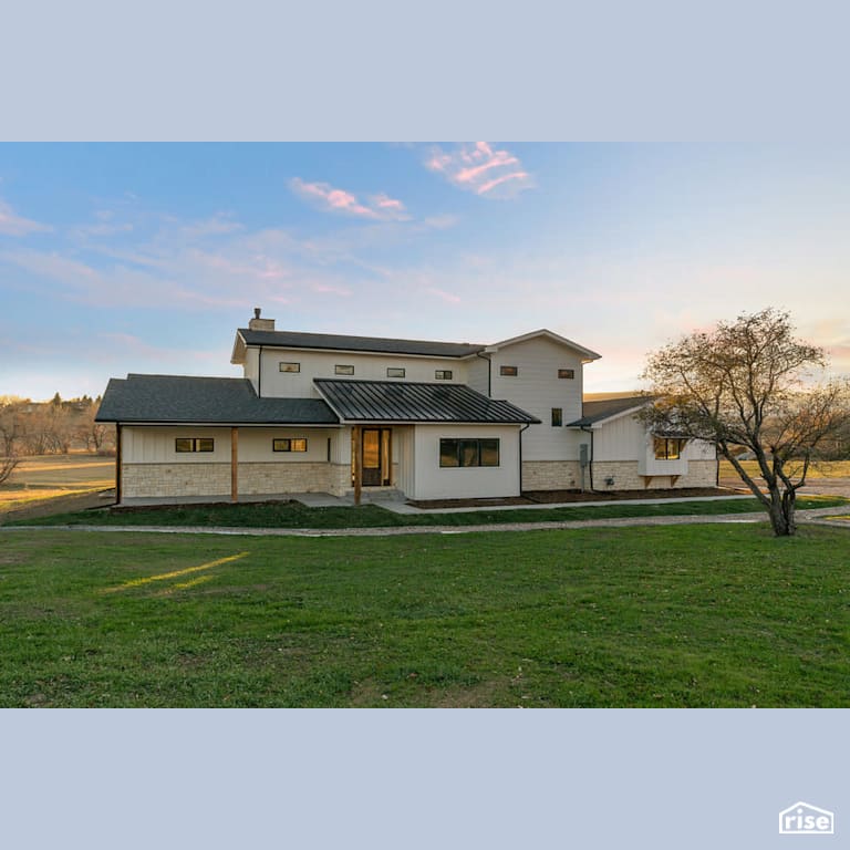 Modern farmhouse exterior with Stone Siding by Revolve Design Build
