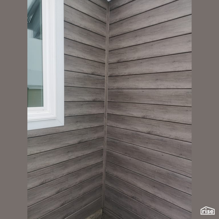 Wood grained composite siding corner with Composite or Engineered Siding by ChamClad by Chameleon