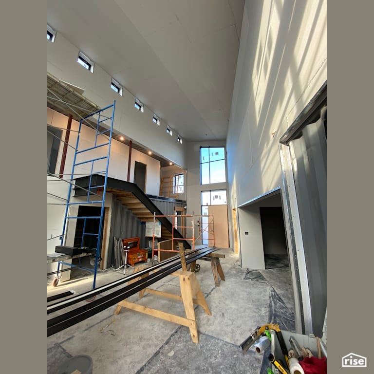 Entryway Under Construction with Fixed Window by Three Squared Inc.