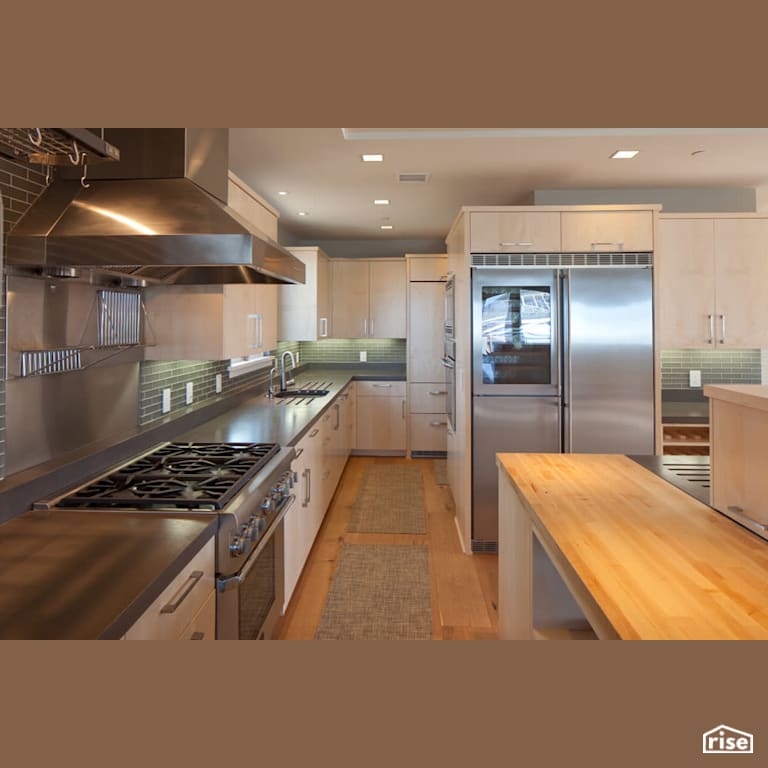 Kitchen with Gas Range by Alliance Green Builders