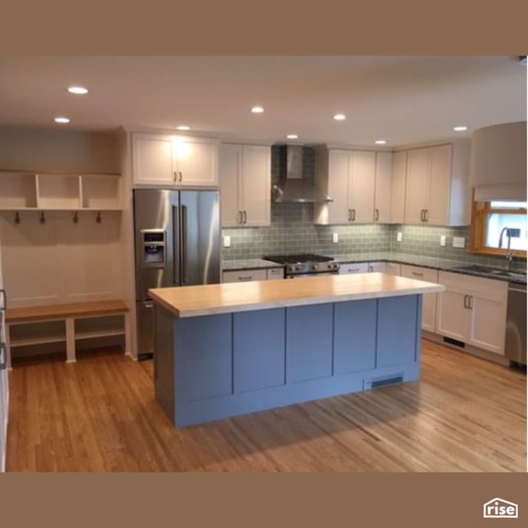 Kitchen with Gas Range by Constructive Builders