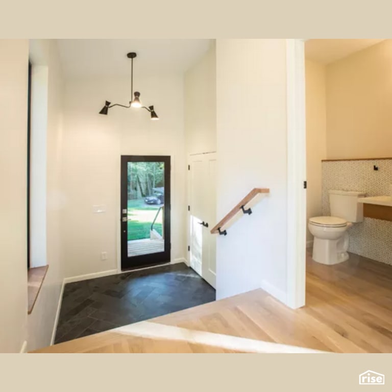 Entryway with Dual Flush Toilet by Constructive Builders